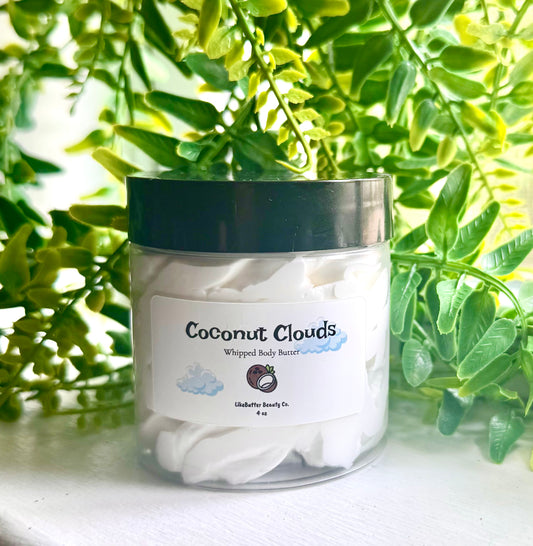 Jar of 'Coconut Clouds' whipped body butter with a green leafy background